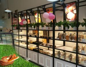 Wholesale Metal Wooden Food Store Shelving LED Light Bread Display Rack With Three Layer from china suppliers