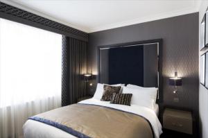 Wholesale Singapore hospitality deluxe double studio room customized furniture Upholstered bed with Wardrobe closet and desk table from china suppliers