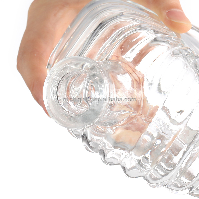 Hot stamping surface handling enhances the beauty of transparent emboss glass bottle
