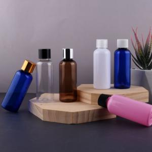 China 100ML PET Plastic Bottles Clear Cosmo Round Bottles With Natural Disc Top Caps on sale