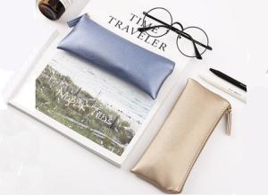 Wholesale Simple pen bag large capacity students simple creative PU leather carry-on handbag makeup pencil case from china suppliers