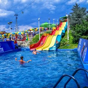 Wholesale ODM Outdoor Large Water Amusement Park Summer Swimming Pool Fiberglass Rainbow Slide For Children from china suppliers