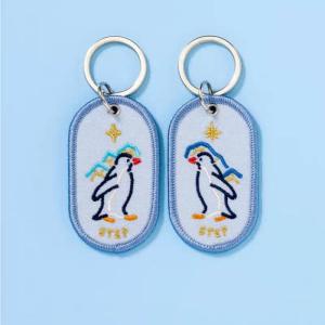 Wholesale Heartwarming Penguin Pair Keychains | Bespoke Keepsakes | Double-Sided Embroidery | Starry Gradient Fabric from china suppliers