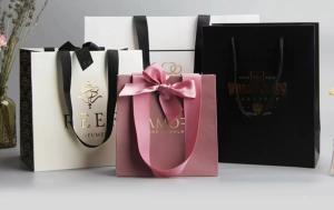 Wholesale Apparel Smoky Printed Paper Shopping Bags C2S Artpaper Ribbon Handle Gift Bags from china suppliers