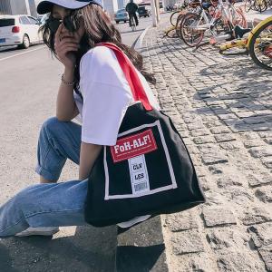 China New Korean fashion personality school style contrast color canvas bag women's portable shoulder bag simple fashion bag on sale