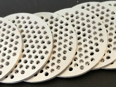 There are eight perforated filter discs with round holes.