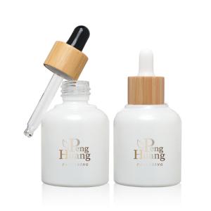 Wholesale Cosmetic Serum Essential Oil Glass Bottle 30ml Empty Bamboo Dropper from china suppliers