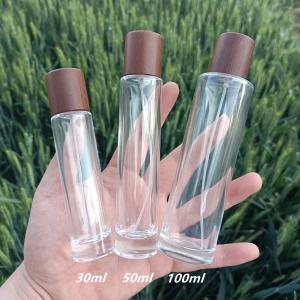Wholesale 100ml Perfume Spray Atomizer Bottle Glass Empty Cylindrical Wooden Lid from china suppliers