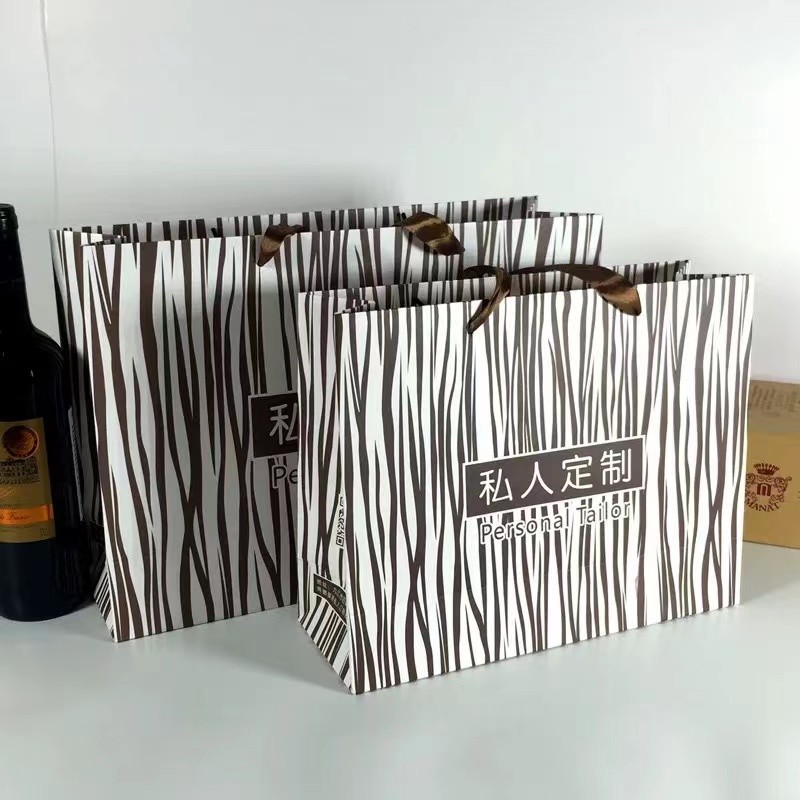 Ribbon Handle Apparel Paper Bag