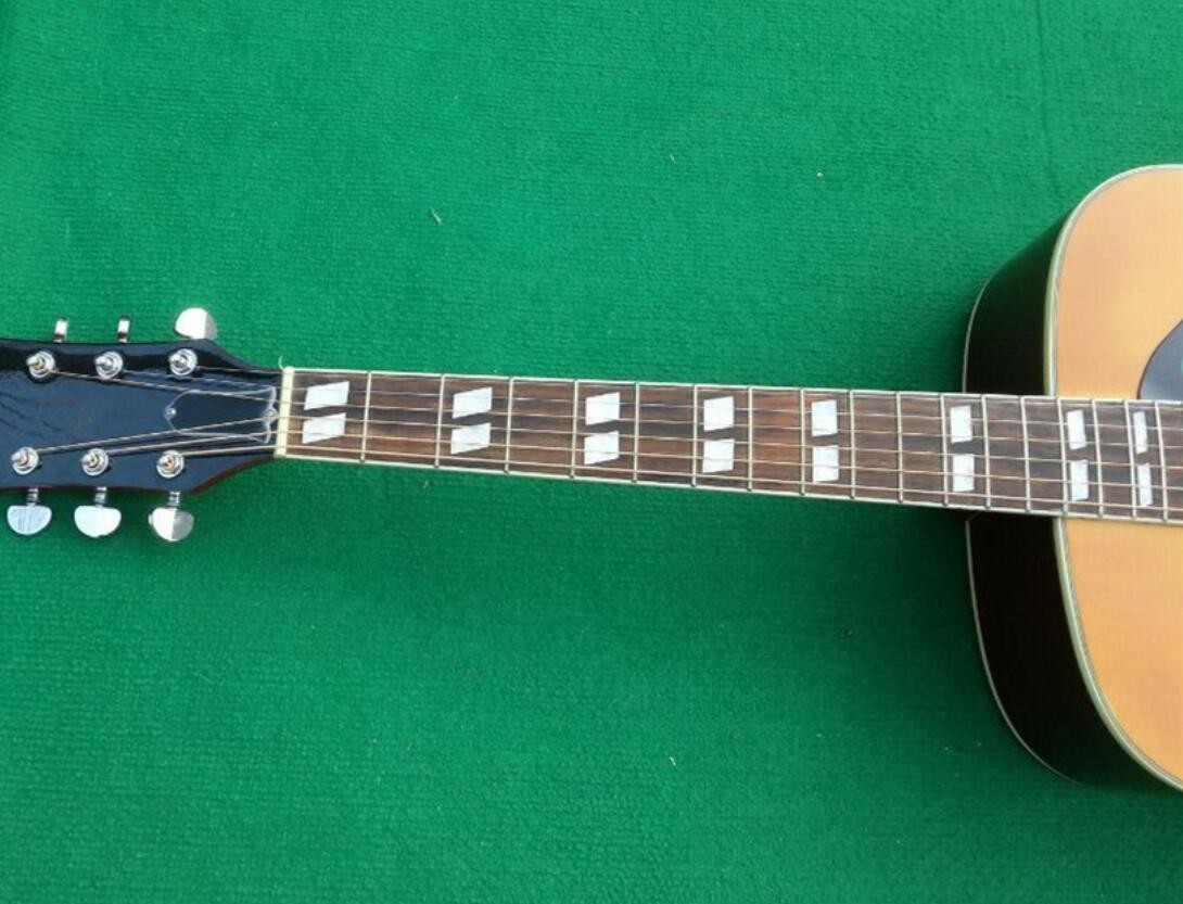 2018 Orange Sunburst Dovo acoustic guitar