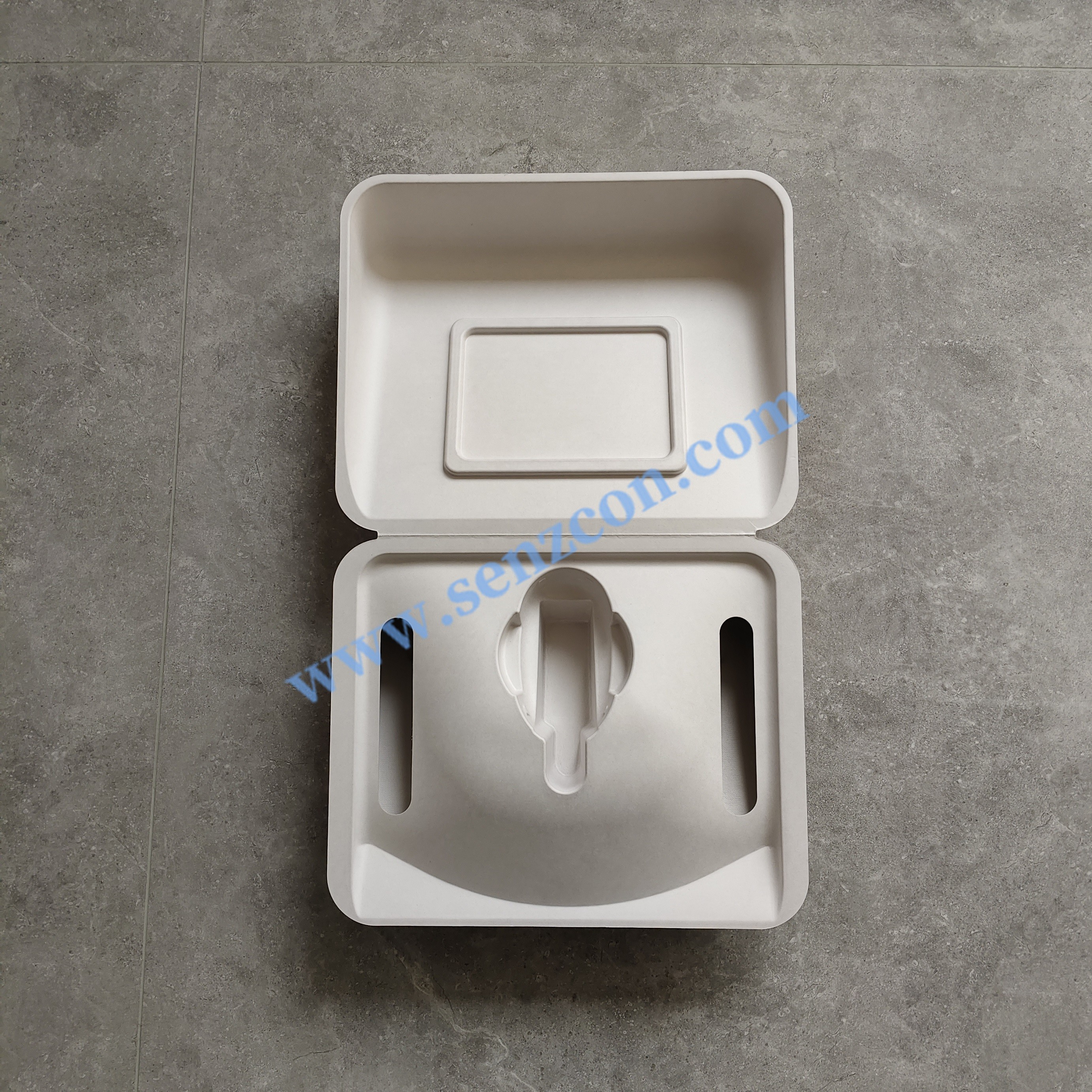 The paper-plastic packaging for high-end beauty instruments is made by combining plant fibers through wet pressing. It features an embedded inner