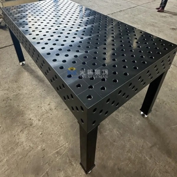D28 welding table in use with various clamps