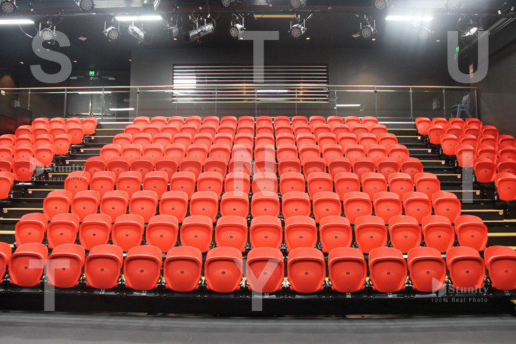 STUNITY Auto tip-up UV resistant wholesale gas assisted PP plastic beam mounted stadium seat with floor mounted brackets