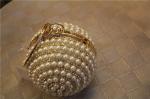 Round high-grade pearls evening bags woman holding a high-end fashion evening