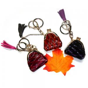 Wholesale ODM Coin Wallet Embossed Leather Keychain With Red Tassel Decoration from china suppliers