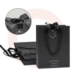 Wholesale Custom Design Luxury Black Matte Thick Paper Clothing Packaging Gift Shopping Bag With Logo Ribbon And Handle from china suppliers