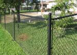 Chain wire fence protects and decorates garden and sports yard