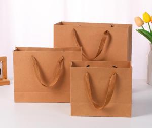 Wholesale Handbags Kraft Paper Bags Christmas Packaging Gift Bags Gift Clothing Store Clothes Printing Logo from china suppliers