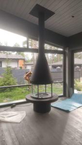 Wholesale Carbon High Grade Black High Style Luxury Modern Steel Round Furniture Glass Art Rotating Furniture rooftop fireplace from china suppliers