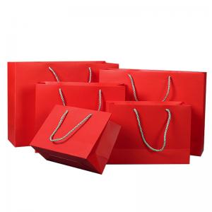China 210gsm Cardboard Printed Paper Gift Bags Colored Promotional Gift Bags on sale