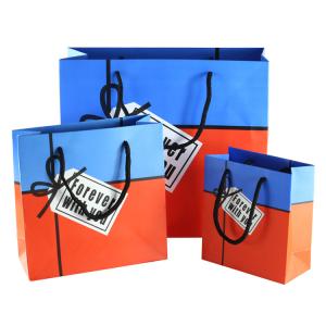 Wholesale Custom printing logo advertising paper bag with false label from china suppliers