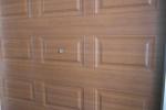 Galvanized steel Sectional remote-controlled garage door For Condos, Wood color