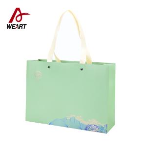 Wholesale Clothing Apparel Printed Reusable Shopping Bags , Modern Designer Paper Bags from china suppliers